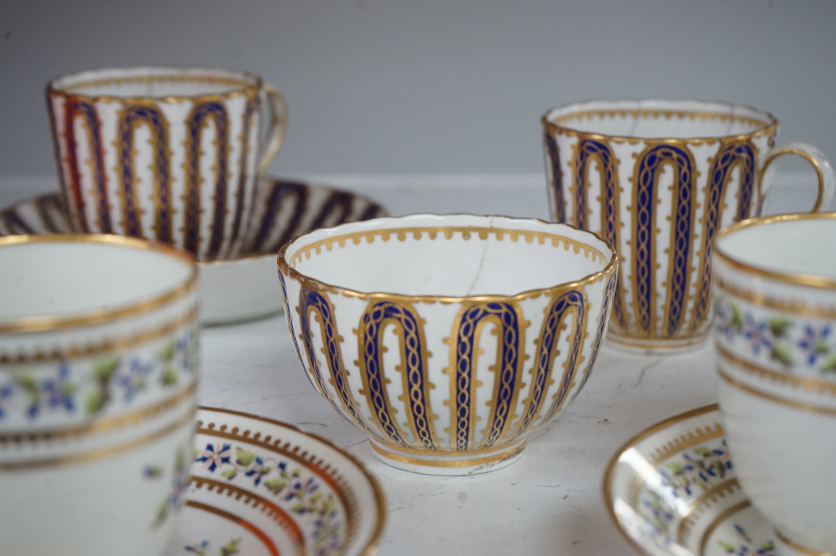 Two late 18th century Derby cornflower pattern coffee cups and saucers and Derby tea and coffee wares, largest 13cm in diameter